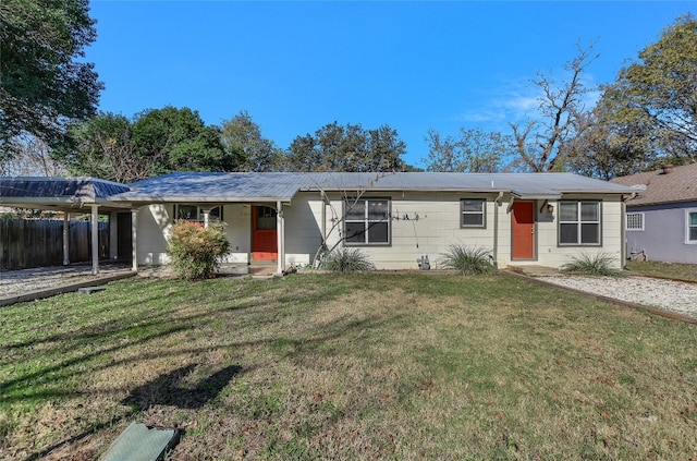 ranch-style house featuring a carport and a front yard