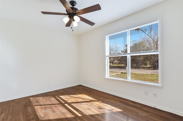 unfurnished room with ceiling fan and dark hardwood / wood-style floors