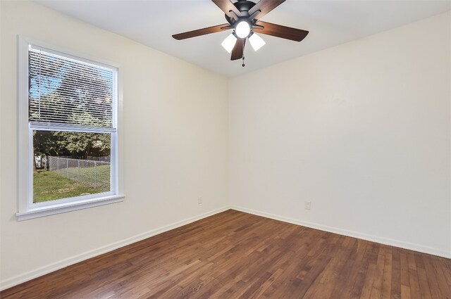 spare room with hardwood / wood-style floors and ceiling fan