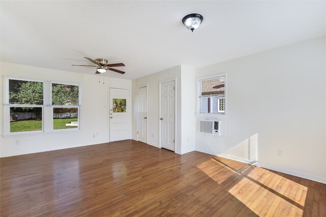 unfurnished room featuring ceiling fan and dark hardwood / wood-style flooring