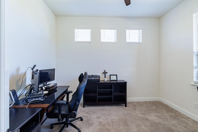 carpeted home office with plenty of natural light