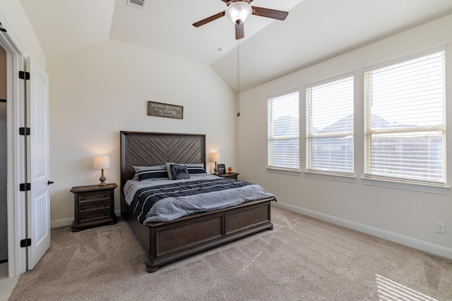 carpeted bedroom featuring ceiling fan and vaulted ceiling