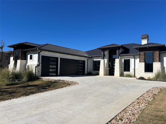 prairie-style home featuring a garage