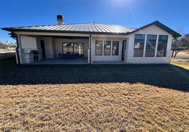 rear view of property featuring a patio area