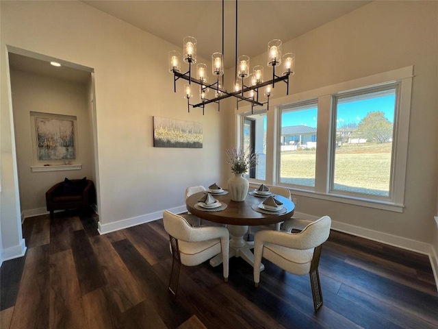 dining area featuring a notable chandelier and dark hardwood / wood-style flooring