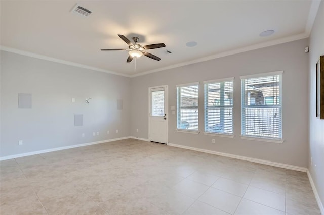 unfurnished room featuring ceiling fan, crown molding, and light tile patterned flooring