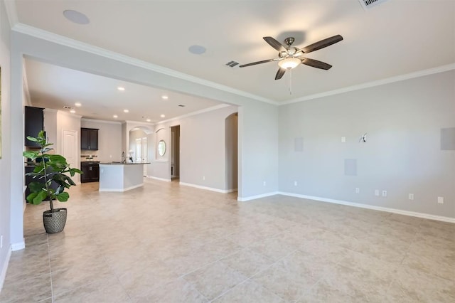 unfurnished living room featuring ceiling fan and ornamental molding