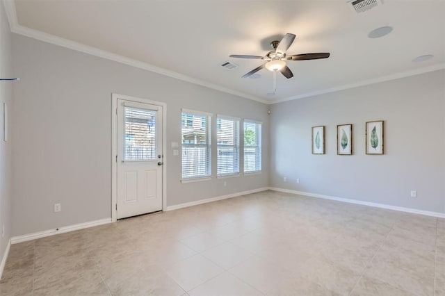 tiled empty room with ceiling fan and crown molding