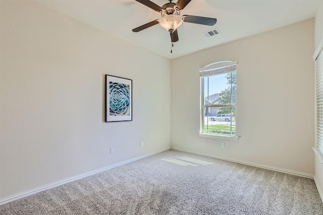 spare room with carpet flooring and ceiling fan