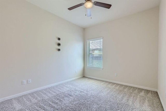 empty room featuring carpet flooring and ceiling fan