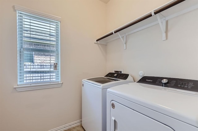 clothes washing area featuring independent washer and dryer