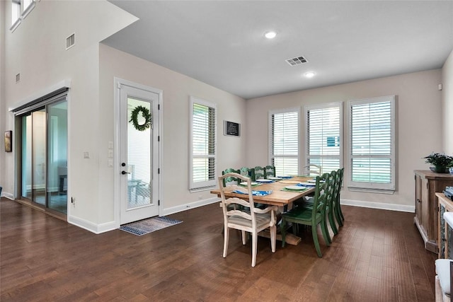 dining area with dark hardwood / wood-style floors