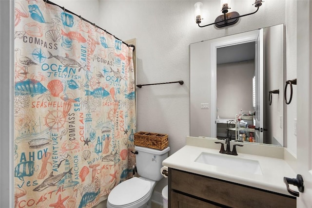 bathroom with a shower with curtain, vanity, and toilet