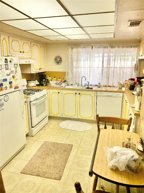 kitchen with sink and white appliances