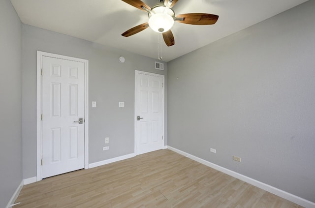 unfurnished bedroom featuring ceiling fan and light hardwood / wood-style floors