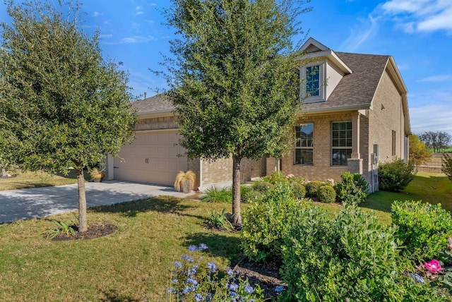 view of front of property featuring a garage and a front lawn