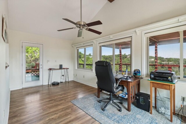 office space featuring vaulted ceiling, wood finished floors, baseboards, and ceiling fan