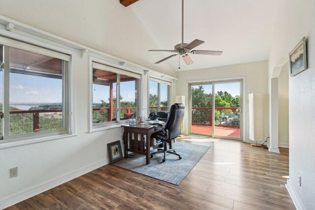 home office featuring ceiling fan, baseboards, wood finished floors, and vaulted ceiling