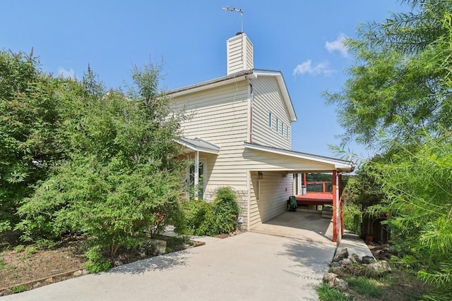 view of property exterior featuring a chimney