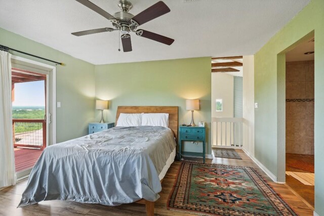 bedroom featuring baseboards, wood finished floors, a ceiling fan, and access to outside