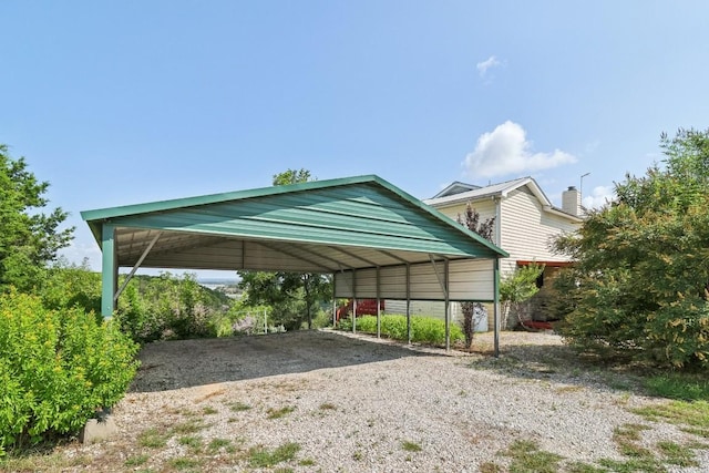 view of vehicle parking featuring a carport