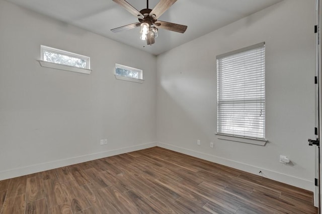 unfurnished room with ceiling fan, plenty of natural light, and wood-type flooring