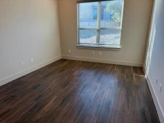 empty room featuring dark hardwood / wood-style floors