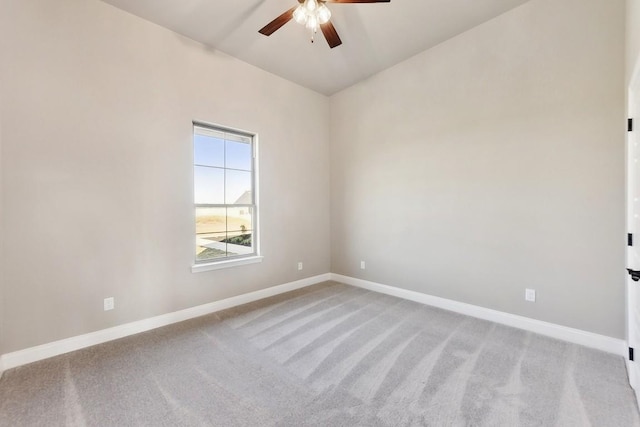 empty room with ceiling fan and light colored carpet