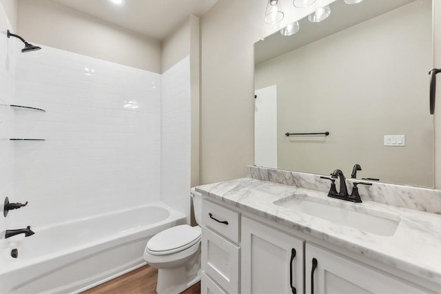 full bathroom featuring wood-type flooring, vanity, toilet, and shower / tub combination