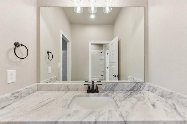 bathroom with shower / tub combination and vanity