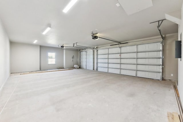 garage with electric panel and a garage door opener