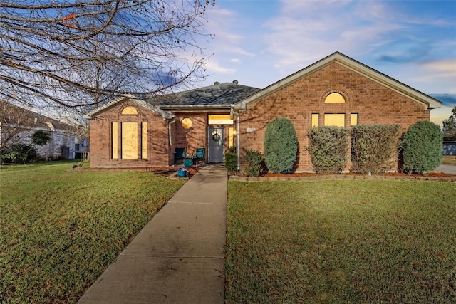 ranch-style house featuring a front lawn