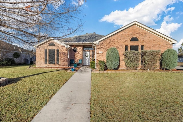 ranch-style home with a front yard