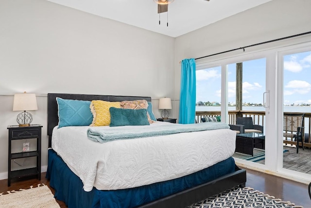 bedroom with access to outside, ceiling fan, and dark wood-type flooring