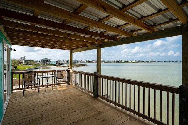 wooden terrace with a water view