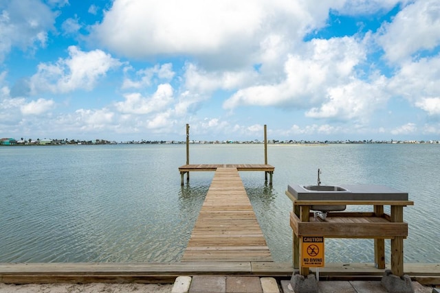 dock area featuring a water view