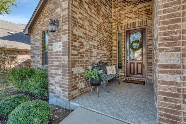 doorway to property with a porch