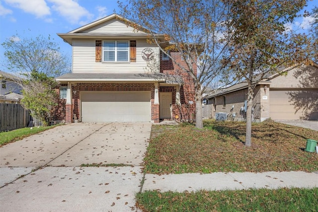 front of property featuring a garage and central AC unit