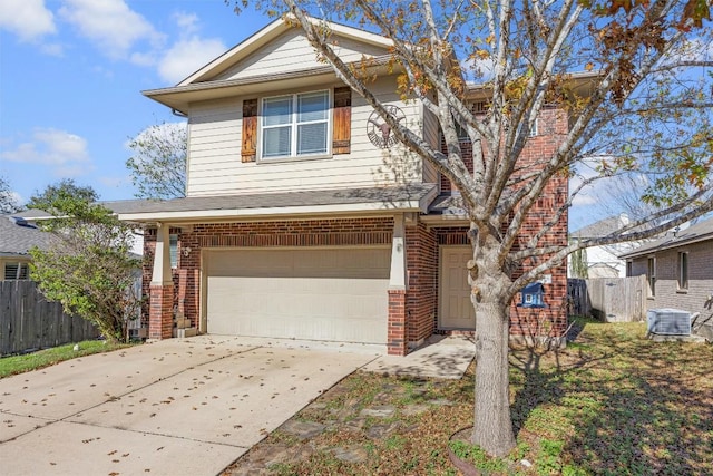 front of property featuring a garage and central air condition unit