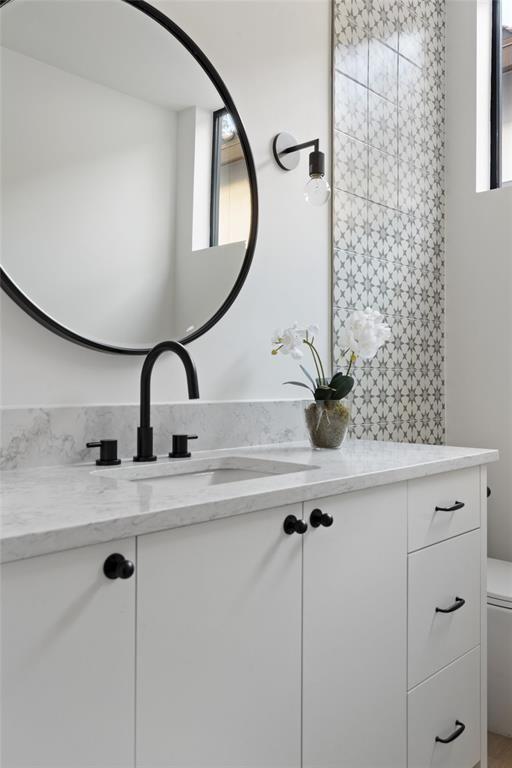 bathroom with vanity and toilet