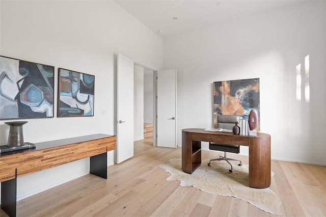 office space with light wood-type flooring