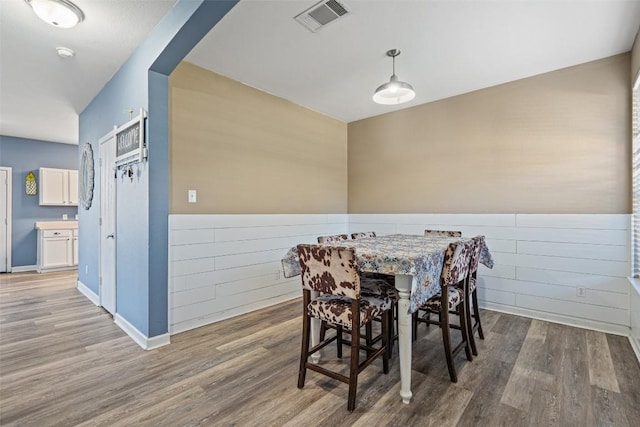 dining space featuring hardwood / wood-style floors