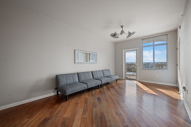 living room with hardwood / wood-style flooring and ceiling fan