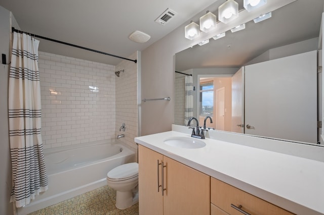 full bathroom with vanity, toilet, and shower / bath combo with shower curtain