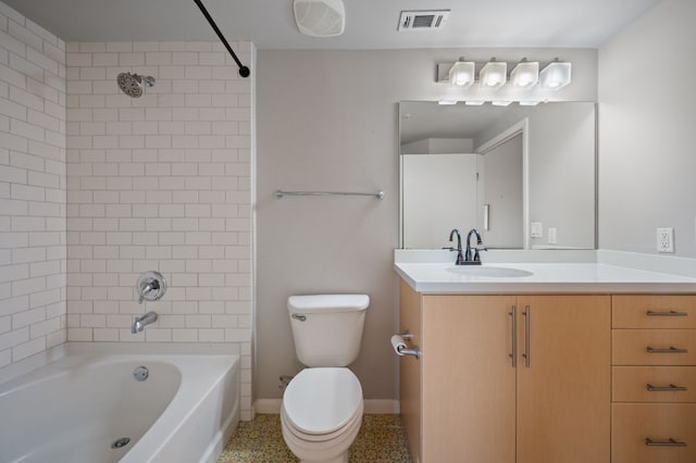 full bathroom featuring vanity, toilet, and tiled shower / bath