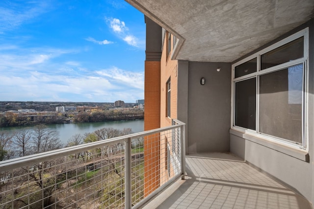 balcony featuring a water view