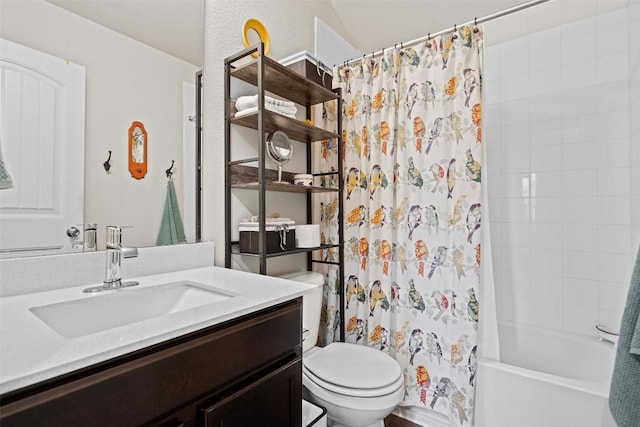 full bathroom with vanity, shower / bath combination with curtain, and toilet