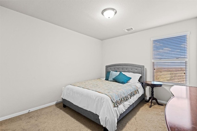 bedroom featuring carpet floors and baseboards