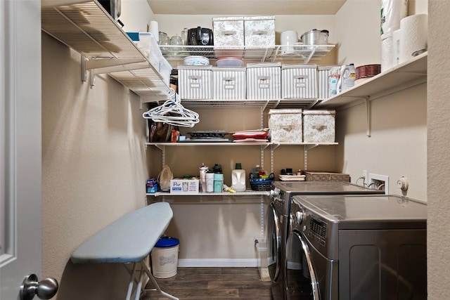 laundry room featuring washing machine and dryer and dark wood-style floors