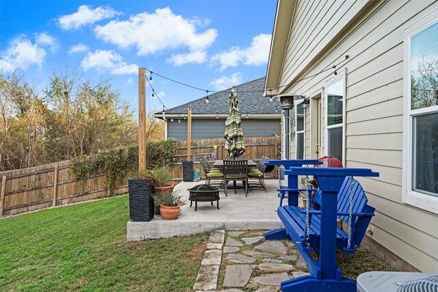 view of patio / terrace with a fire pit